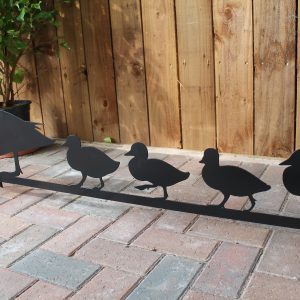 row of steel ducklings