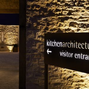 visitor-entrance-sign-at-night