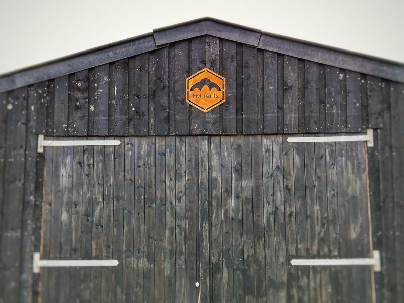 Barn warehouse with corten sign