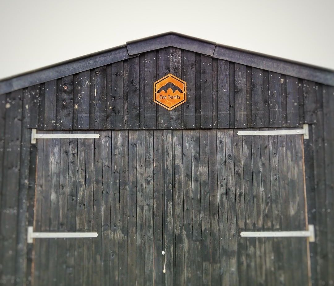 Barn warehouse with corten sign