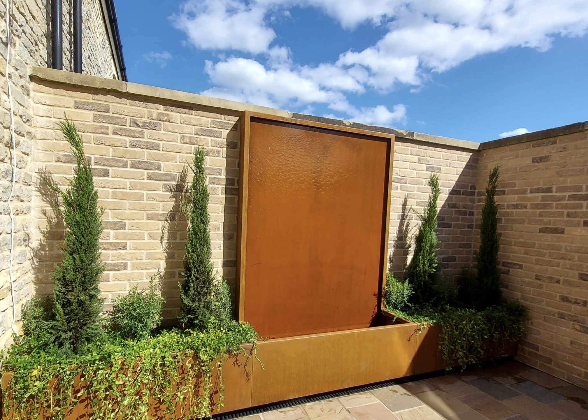 Corten water wall with side planters